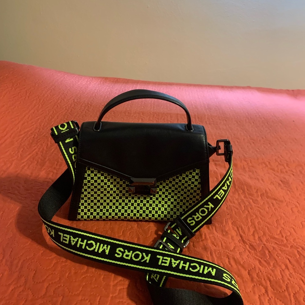 Newer used 2 times leather purse.  10 x 5.  Adjustable shoulder strap 40”.